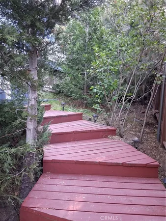 a backyard of a house with large trees