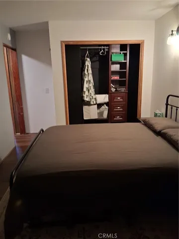 a bedroom with a bed and window