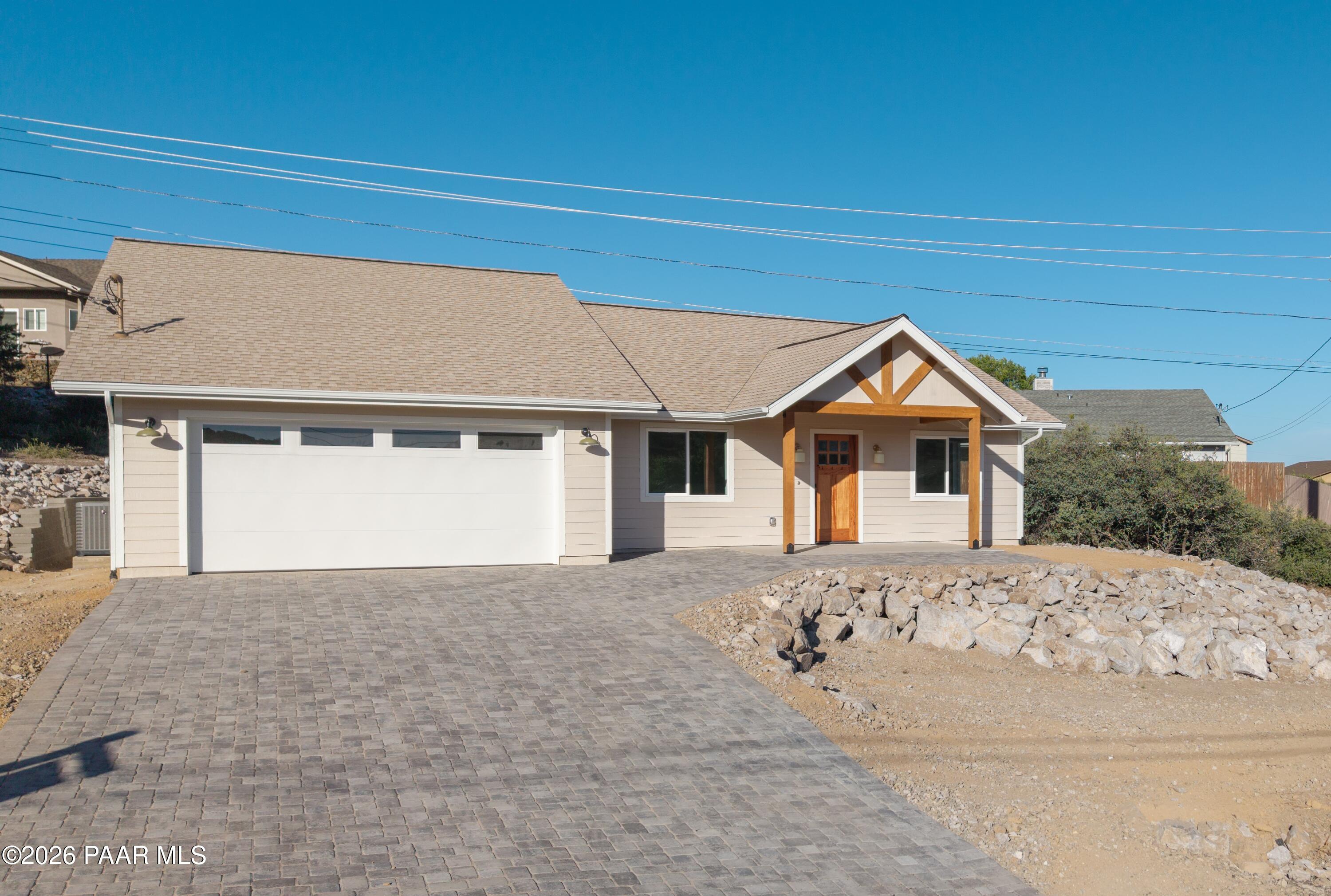 4920 East Amber Road Prescott, AZ 86301 - Photo 2 of 38 a front view of a house with a yard