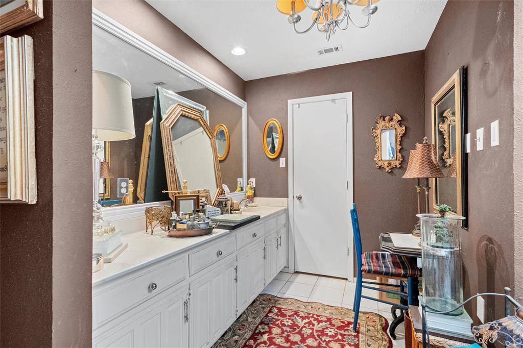 2000 Shadow Ridge Drive Arlington, TX 76006 - Photo 16 of 23 a spacious bathroom with a double vanity sink a mirror a and a window