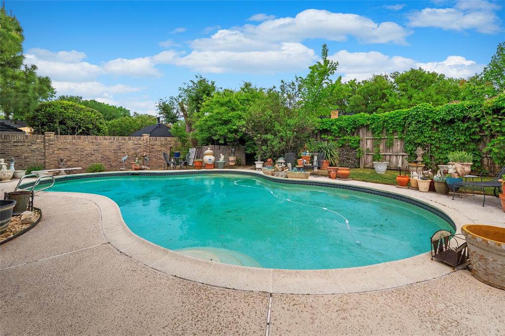 2000 Shadow Ridge Drive Arlington, TX 76006 - Photo 18 of 23 a view of a swimming pool with a yard