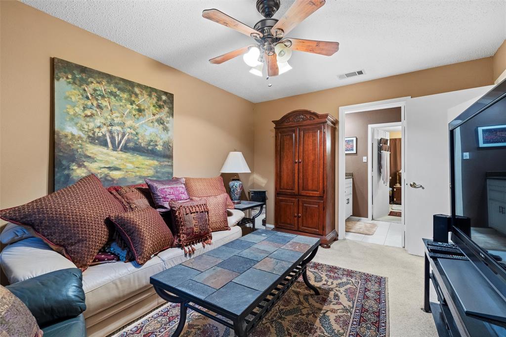 2000 Shadow Ridge Drive Arlington, TX 76006 - Photo 23 of 23 a living room with furniture and a flat screen tv