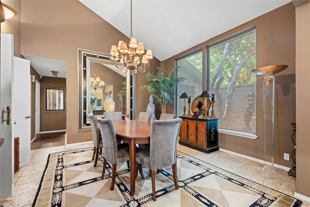 2000 Shadow Ridge Drive Arlington, TX 76006 - Photo 6 of 23 a view of a dining room with furniture a chandelier and large windows