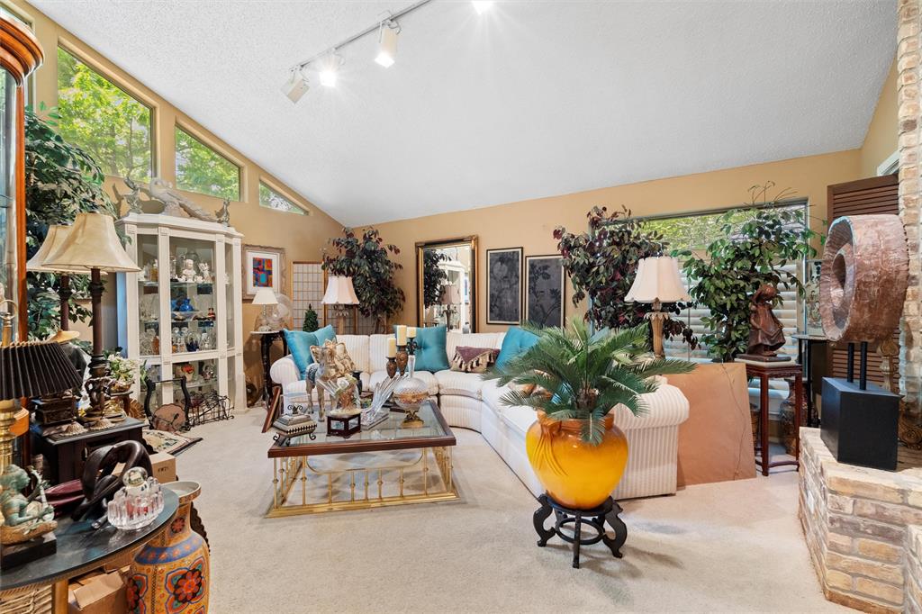 2000 Shadow Ridge Drive Arlington, TX 76006 - Photo 7 of 23 a living room with furniture a chandelier and a large window