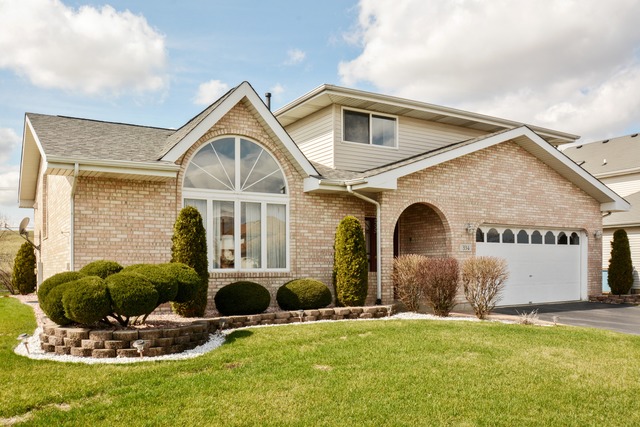 334 Highland Road Matteson, IL 60443 - Photo 1 of 10 a front view of a house with a yard