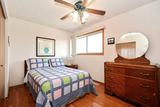 334 Highland Road Matteson, IL 60443 - Photo 9 of 10 a bedroom with a bed and window