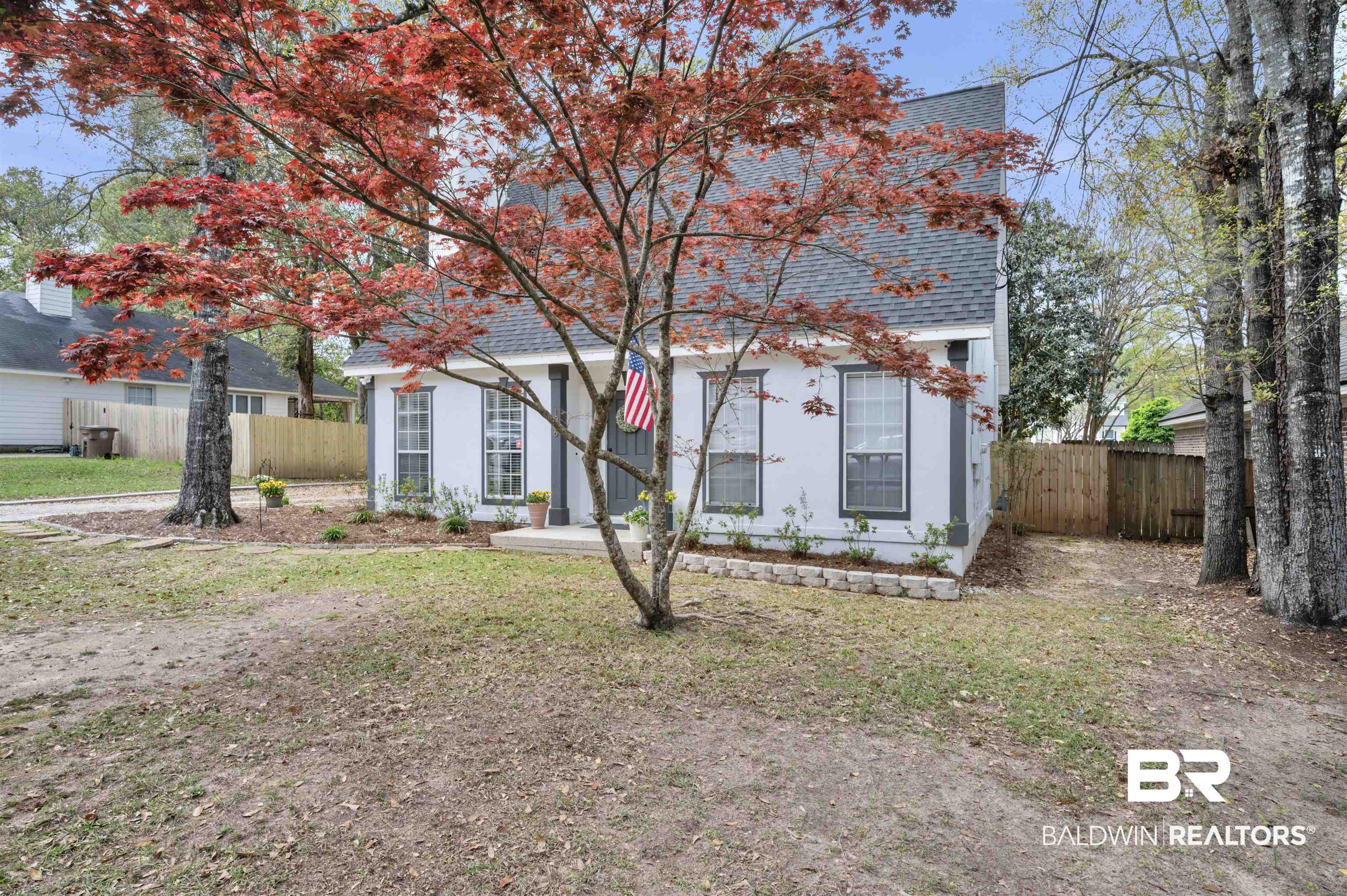 1066 Linlen Avenue Mobile, AL 36609 - Photo 2 of 22 View of front facade with a shingled roof, fence, and a front lawn