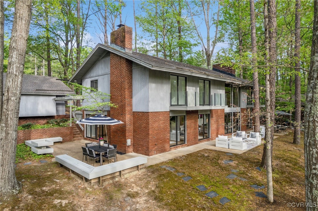 Rear view of property with outdoor lounge area, a