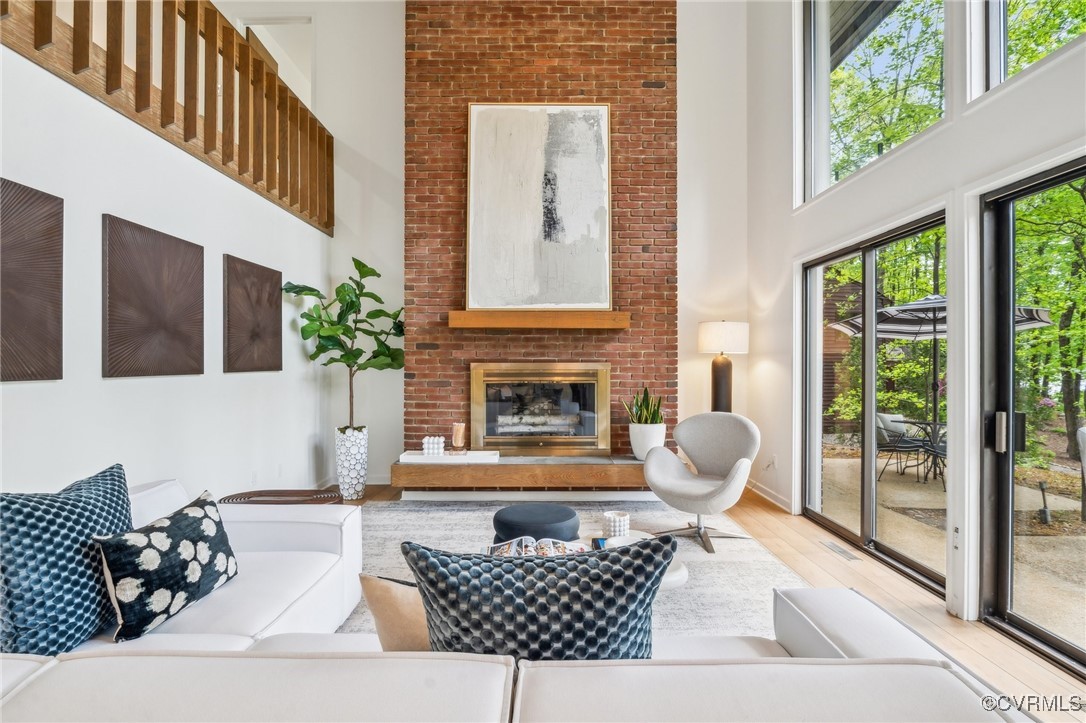 4460 Cheyenne Road Richmond, VA 23235 - Photo 18 of 47 Living area featuring wood finished floors, a bric