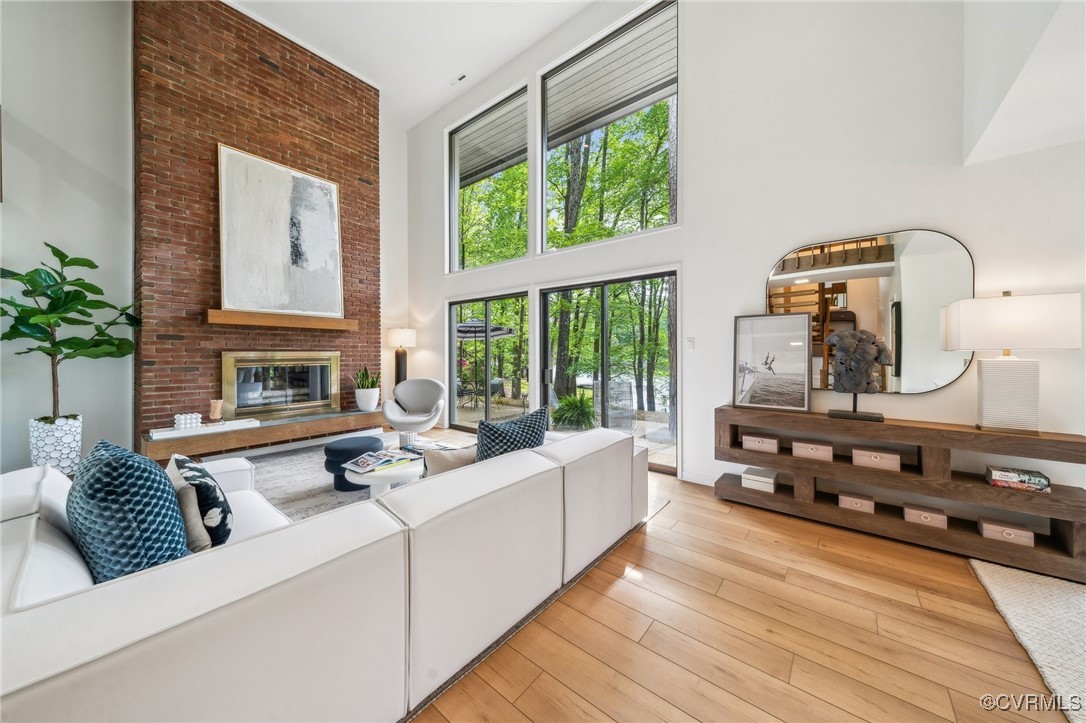 4460 Cheyenne Road Richmond, VA 23235 - Photo 19 of 47 Living area featuring a high ceiling, a brick fire
