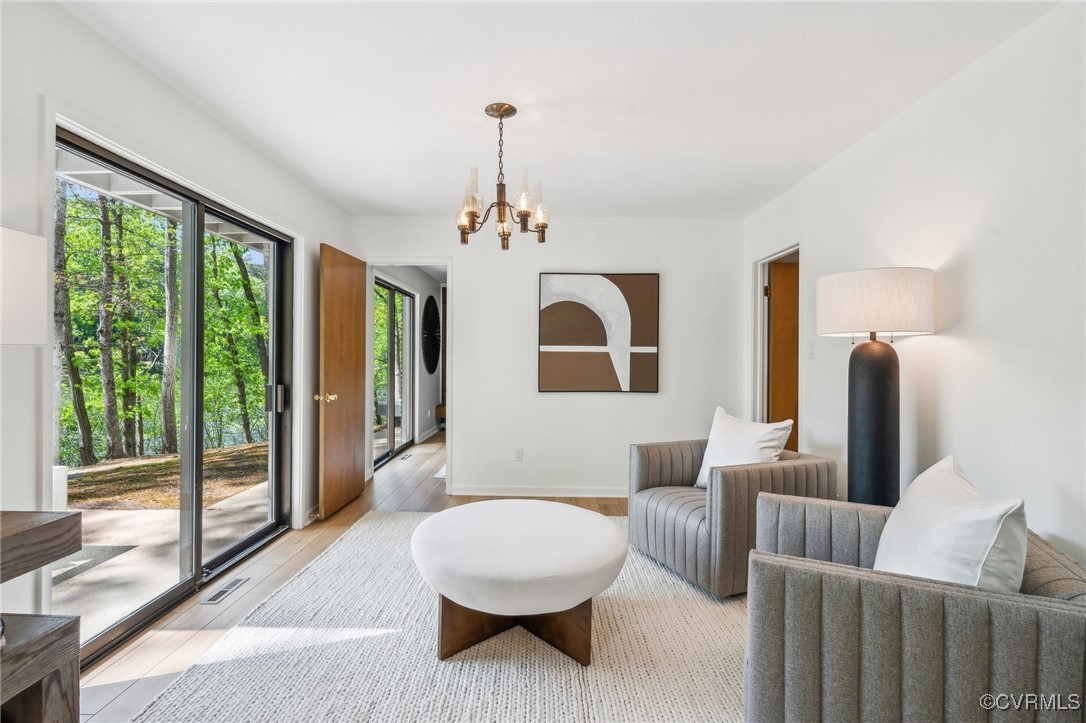 4460 Cheyenne Road Richmond, VA 23235 - Photo 21 of 47 Sitting room with a chandelier, light wood-style f