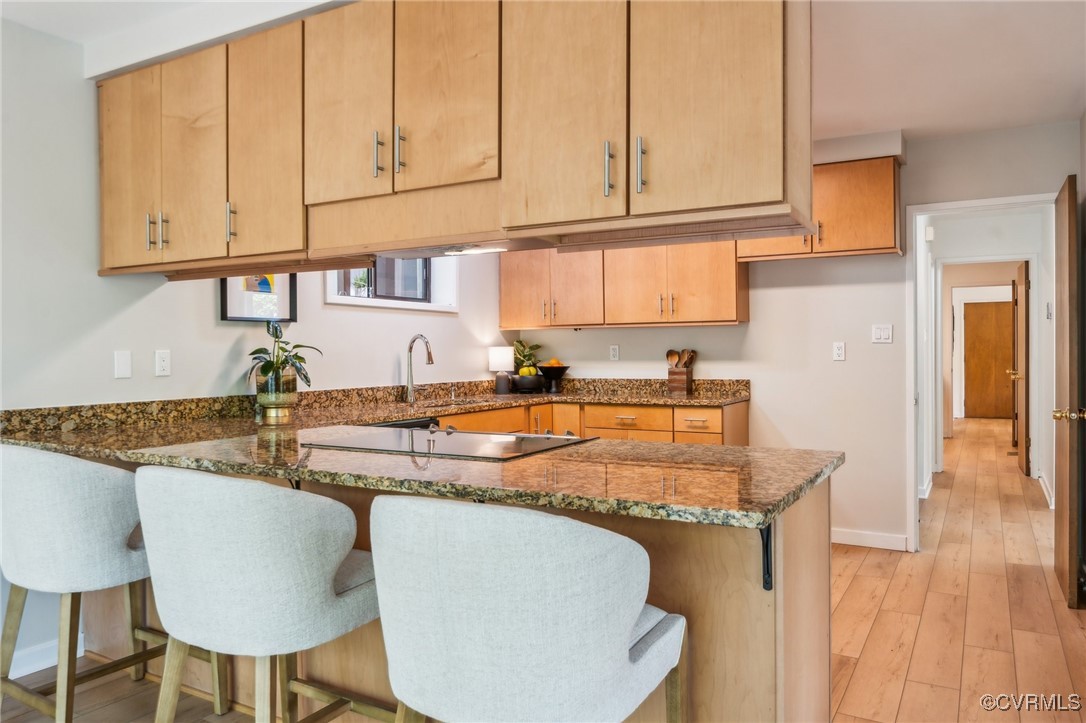 4460 Cheyenne Road Richmond, VA 23235 - Photo 26 of 47 Kitchen featuring dark stone countertops, a sink,