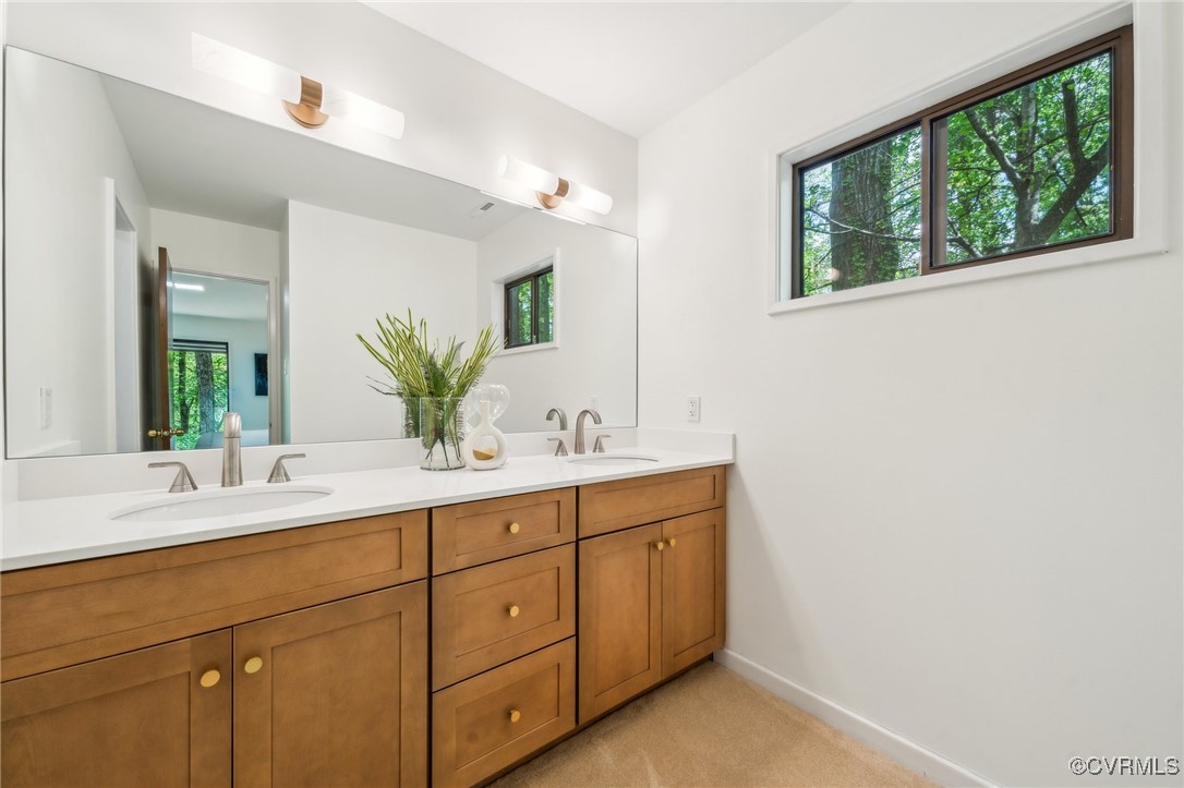 4460 Cheyenne Road Richmond, VA 23235 - Photo 32 of 47 Full bath with double vanity, baseboards, and a si