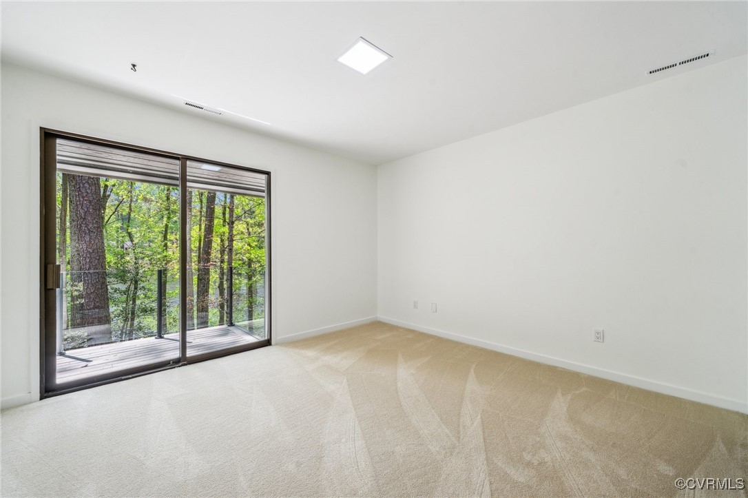 4460 Cheyenne Road Richmond, VA 23235 - Photo 37 of 47 Spare room featuring light carpet, visible vents,