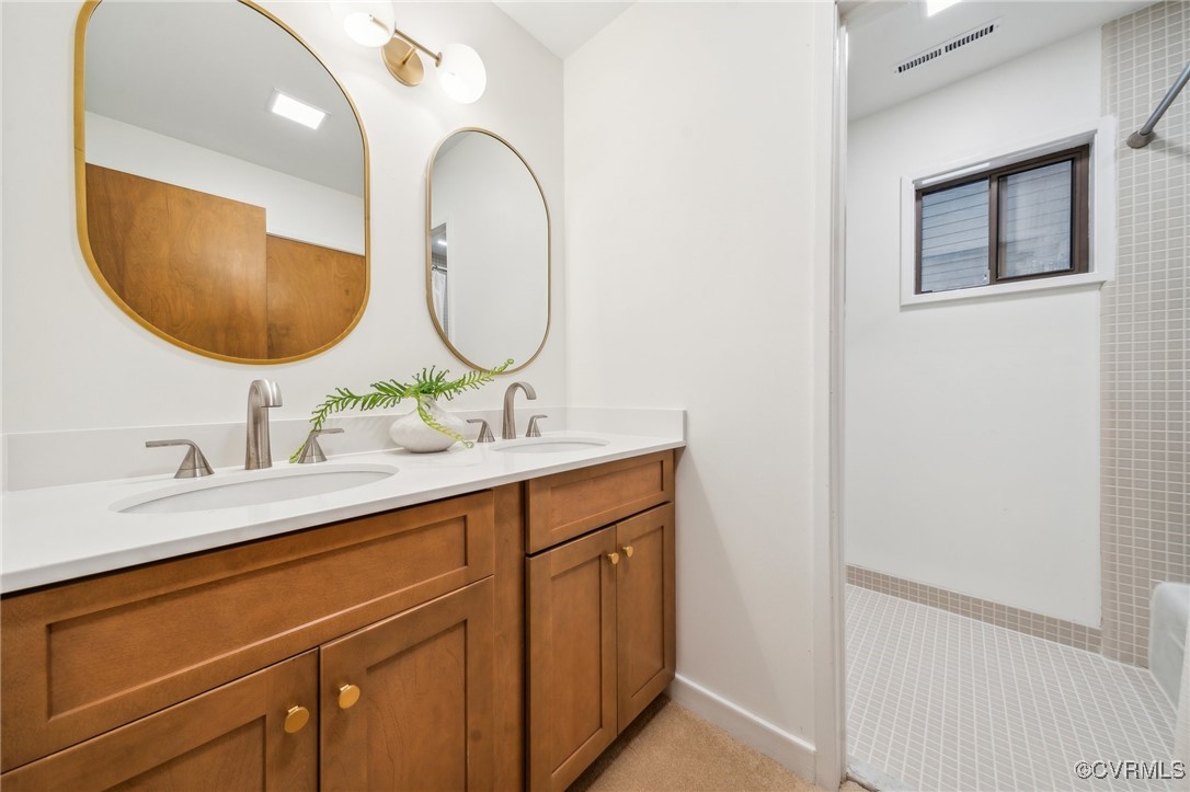 4460 Cheyenne Road Richmond, VA 23235 - Photo 39 of 47 Bathroom with walk in shower, a sink, visible vent