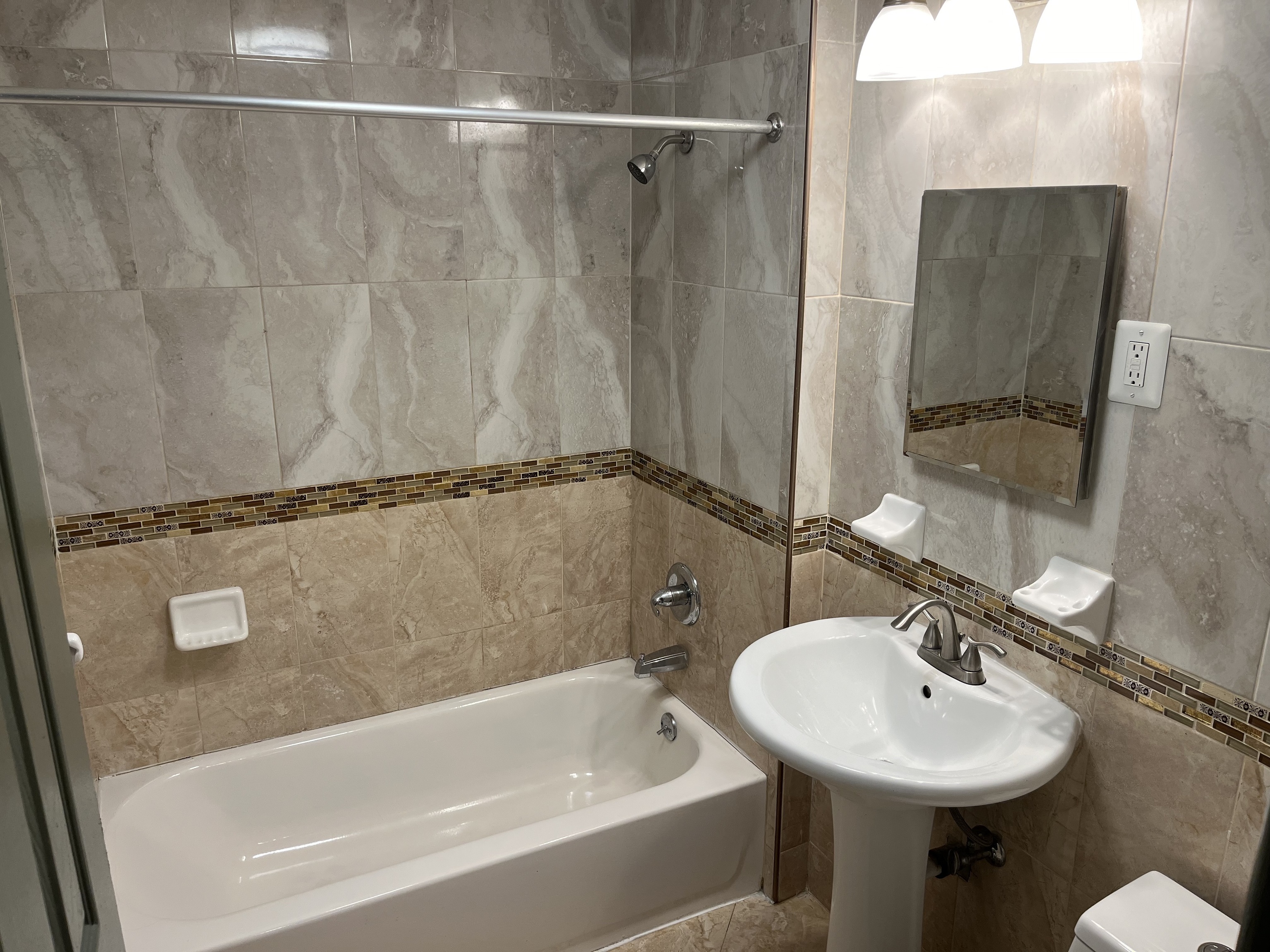 32 Cook Avenue, Unit 209 Meriden, CT 06451 - Photo 7 of 12 a bathroom with a sink and mirror