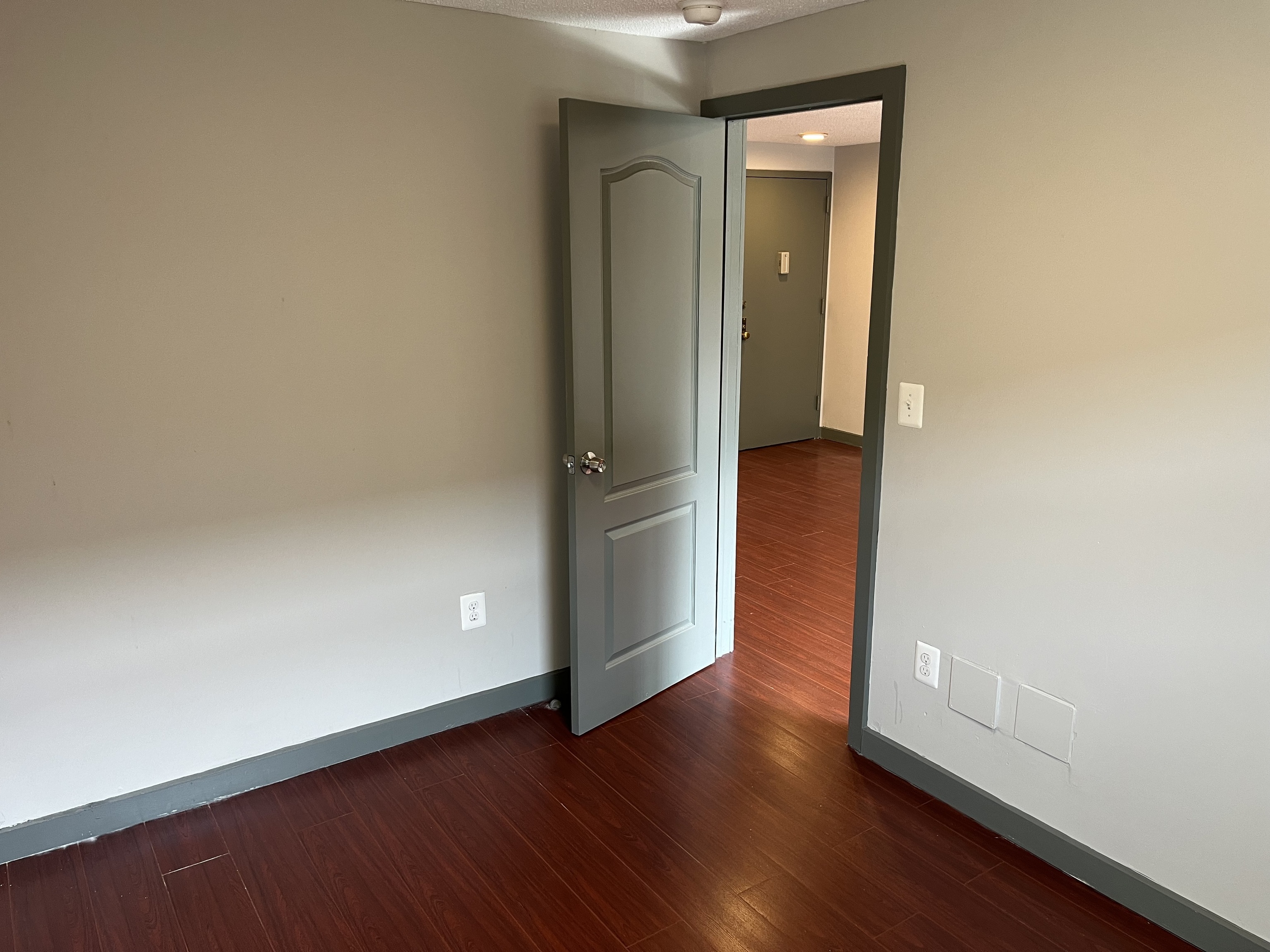 32 Cook Avenue, Unit 209 Meriden, CT 06451 - Photo 8 of 12 an empty room with wooden floor and a window