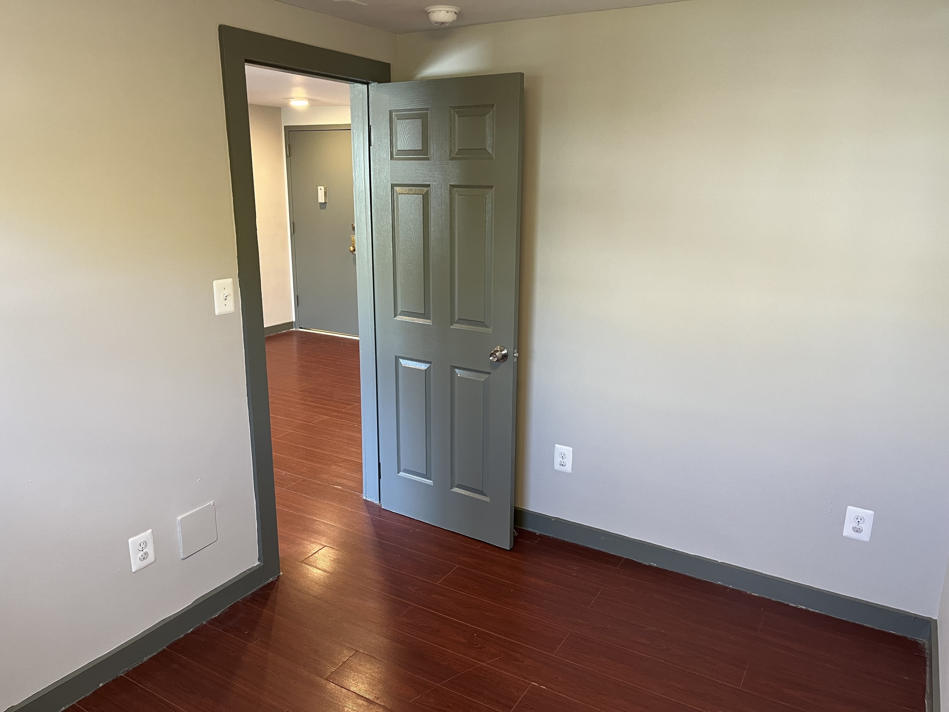 32 Cook Avenue, Unit 209 Meriden, CT 06451 - Photo 10 of 12 an empty room with wooden floor and closet