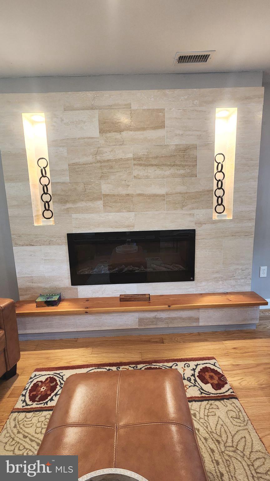 14004 Beechvue Lane Silver Spring, MD 20906 - Photo 4 of 57 Dramatic stone & electric fireplace