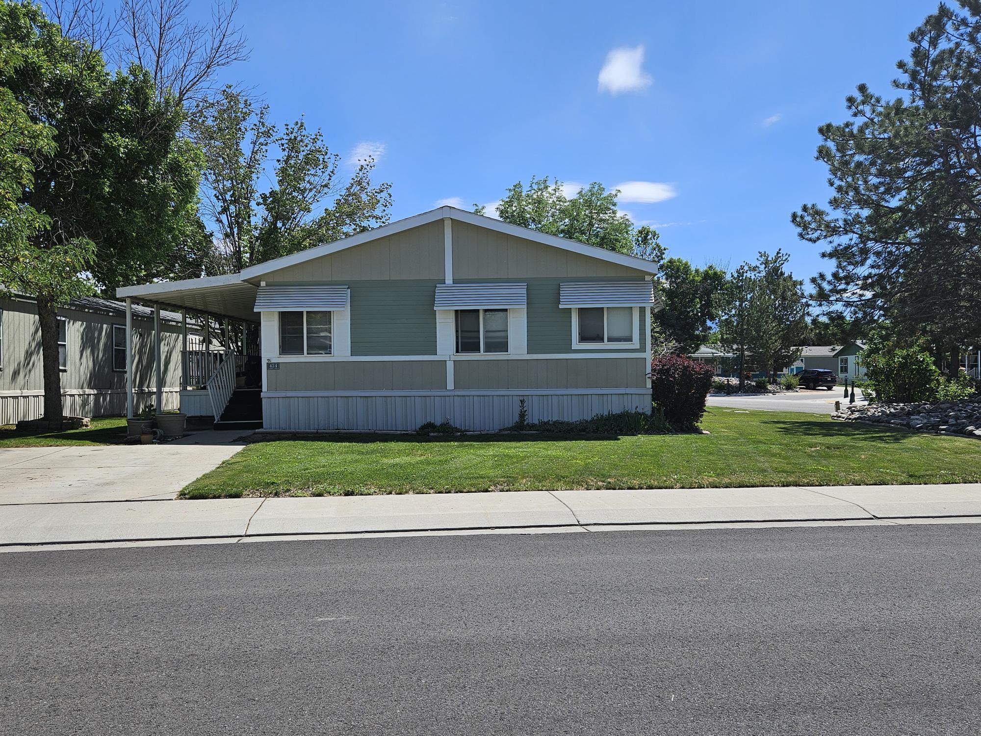 435 32 Road, Unit 424 Clifton, CO 81520 - Photo 1 of 21 a front view of a house with a yard