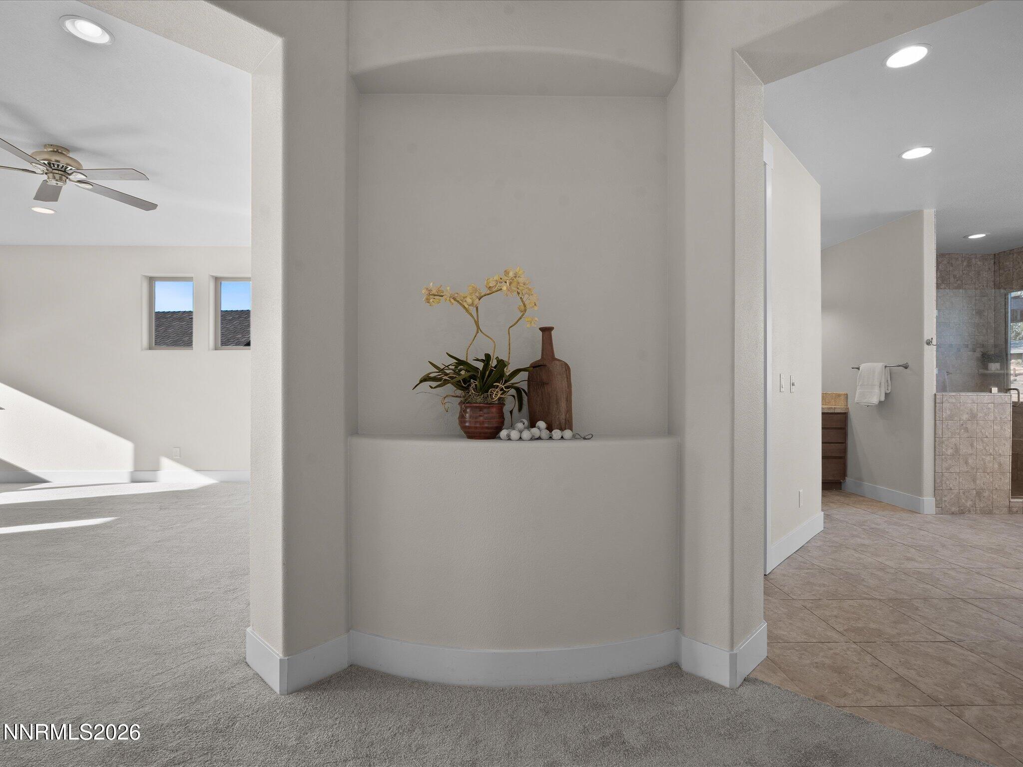 5585 East Hidden Valley Drive Reno, NV 89502 - Photo 17 of 40 a view of a hallway with closet and mirror