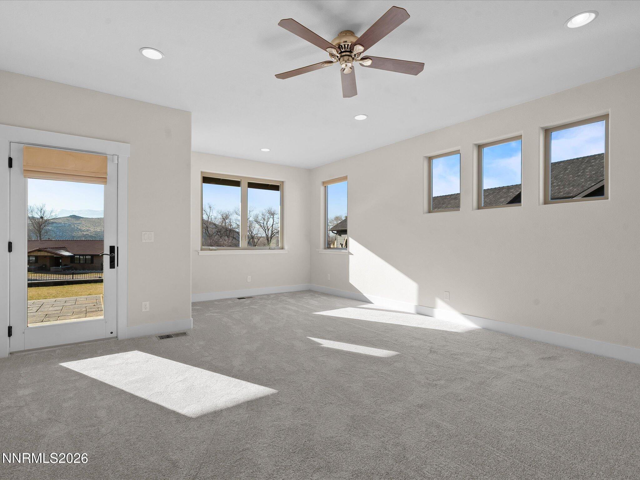 5585 East Hidden Valley Drive Reno, NV 89502 - Photo 18 of 40 a view of an empty room with a window