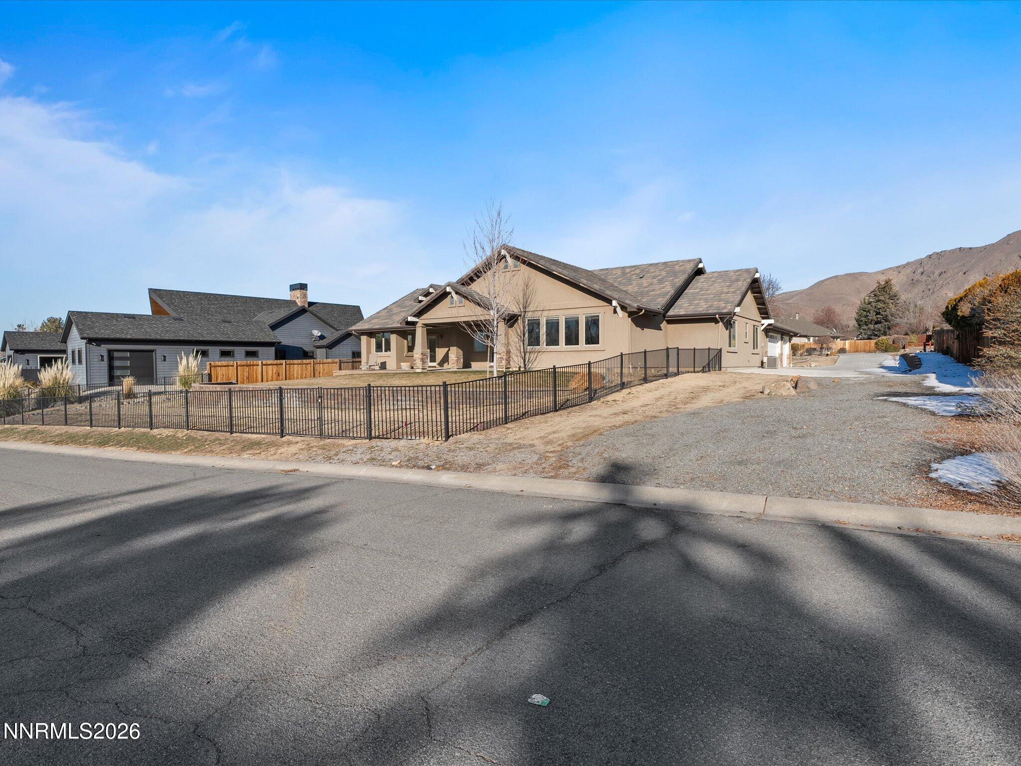 5585 East Hidden Valley Drive Reno, NV 89502 - Photo 32 of 40 a view of a house with a road