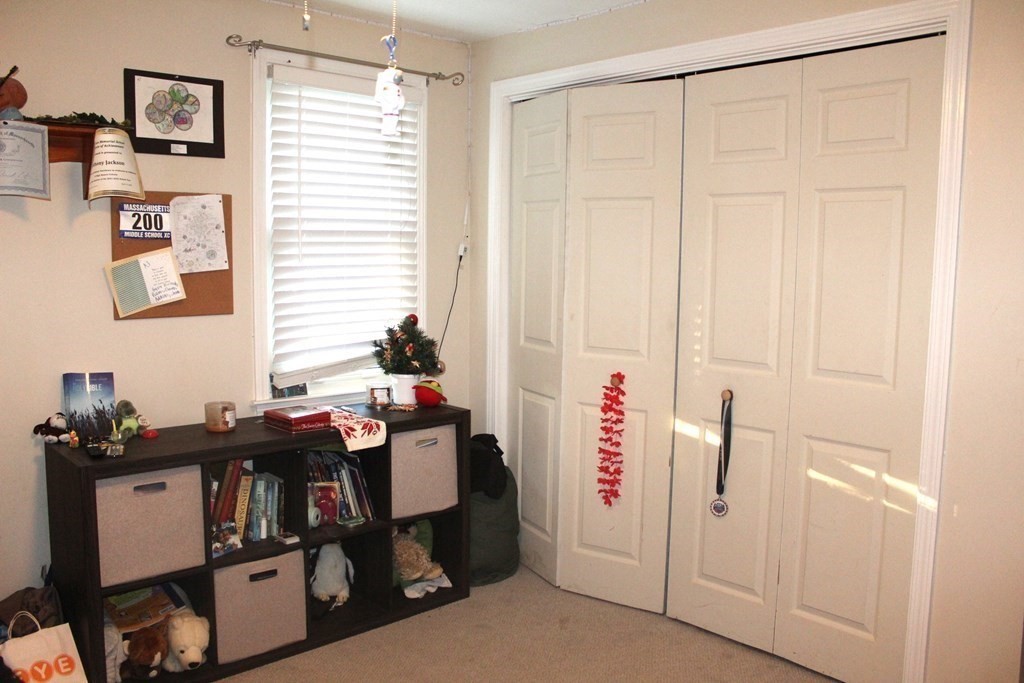 25 3rd Avenue Bellingham, MA 02019 - Photo 14 of 20 a view of a workspace with furniture and a window