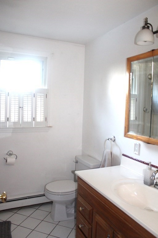 25 3rd Avenue Bellingham, MA 02019 - Photo 15 of 20 a bathroom with a sink a toilet and vanity