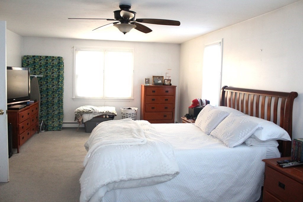 25 3rd Avenue Bellingham, MA 02019 - Photo 16 of 20 a bedroom with a bed and a television
