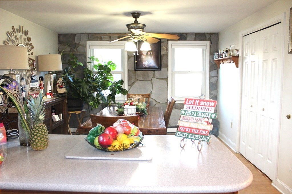 25 3rd Avenue Bellingham, MA 02019 - Photo 4 of 20 a living room with furniture and a chandelier