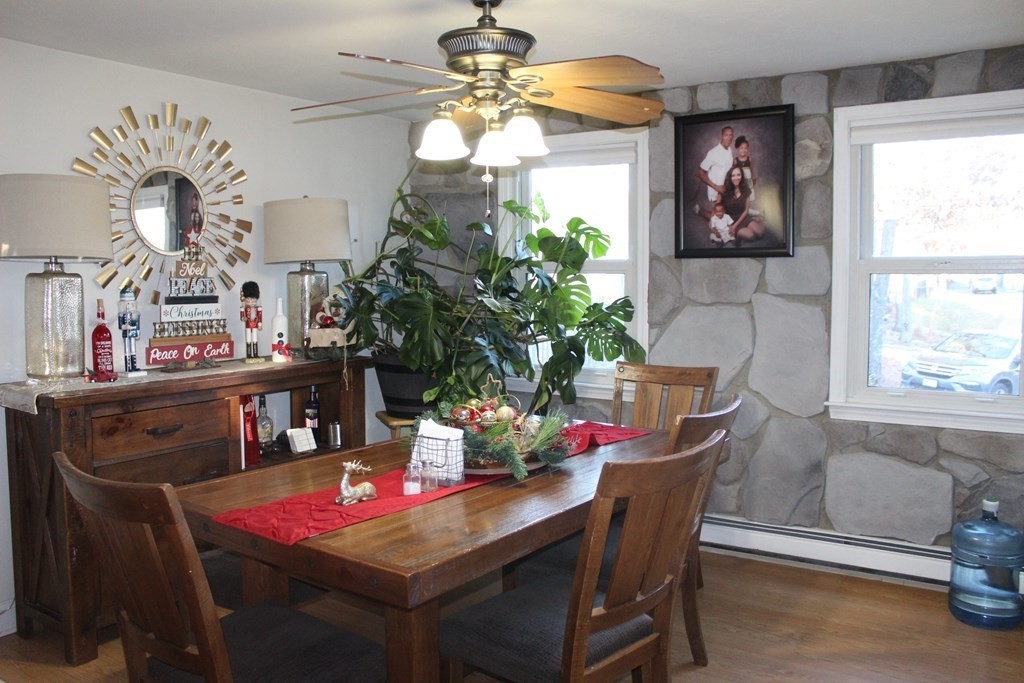 25 3rd Avenue Bellingham, MA 02019 - Photo 5 of 20 a view of a dining room with furniture and chandelier