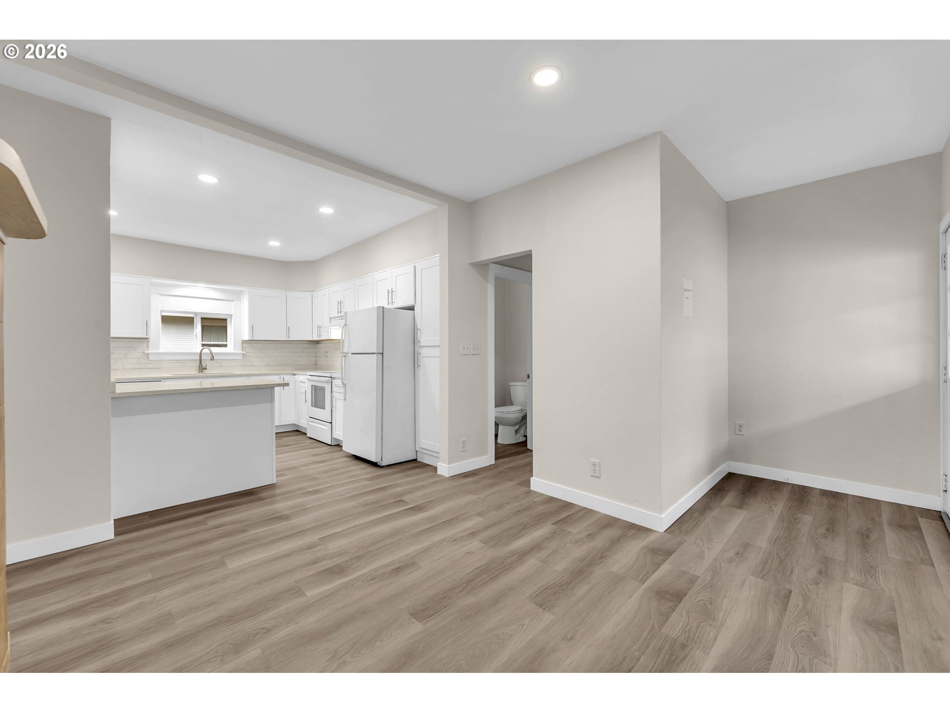 647 Southeast Russell Street Camas, WA 98607 - Photo 12 of 21 a view of a kitchen with wooden floor