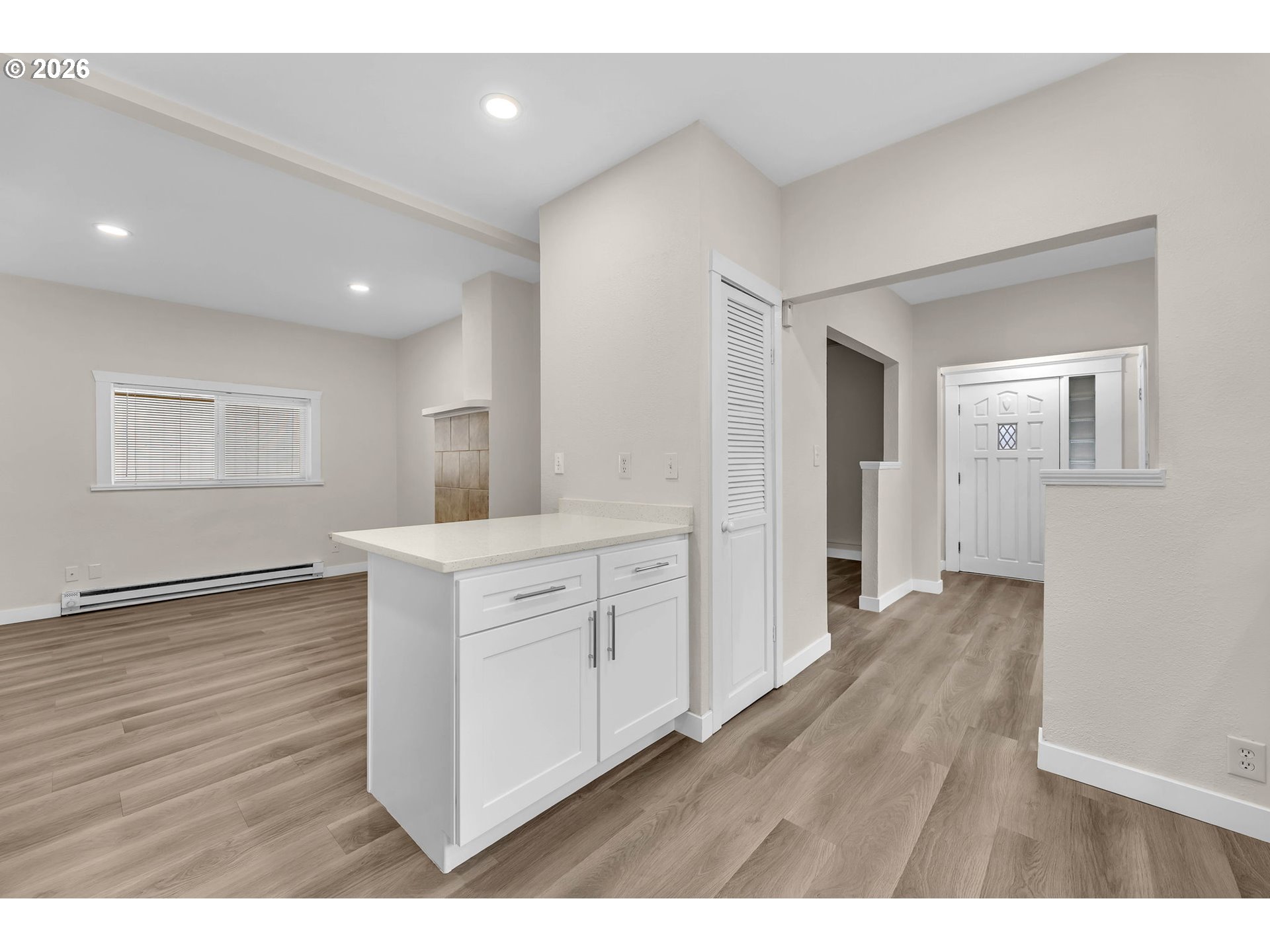 647 Southeast Russell Street Camas, WA 98607 - Photo 10 of 21 a kitchen with white cabinets and wooden floor