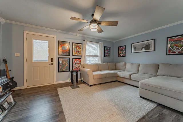 a living room with furniture and a window