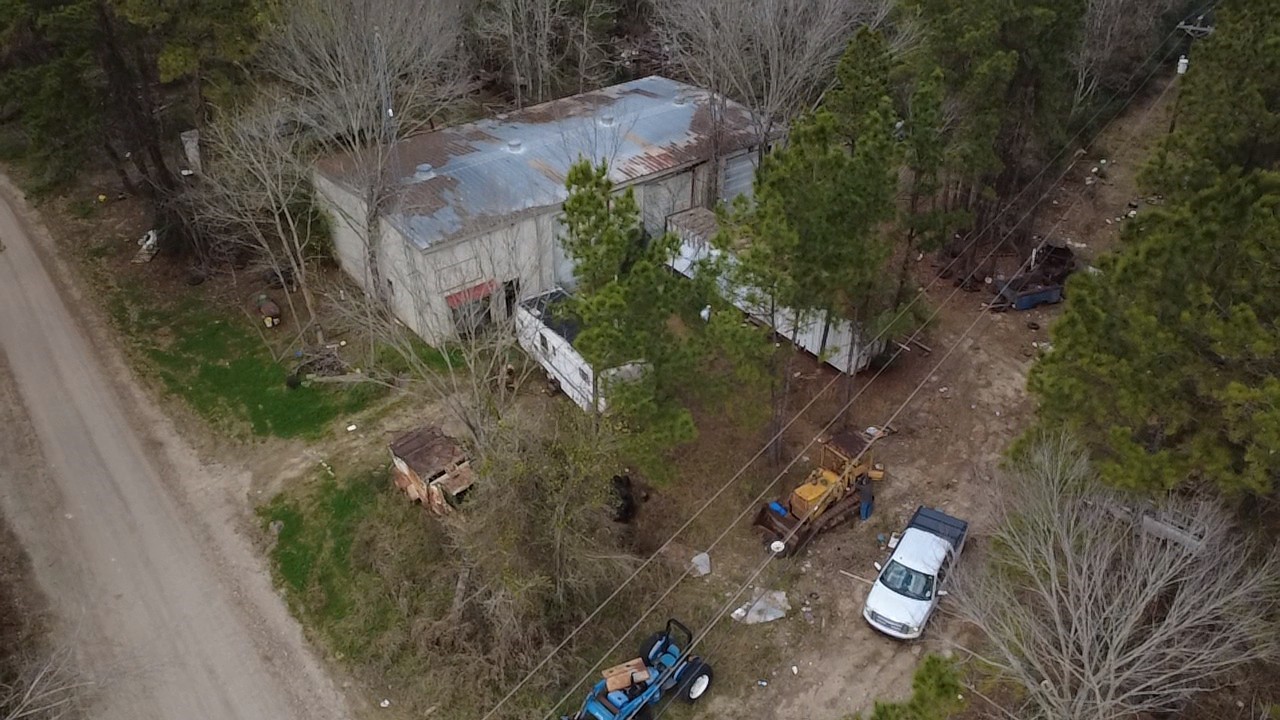 140 Mosely Livingston, TX 77351 - Photo 2 of 9 an aerial view of a house with a yard