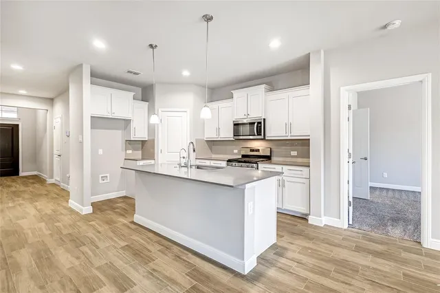 a large kitchen with cabinets