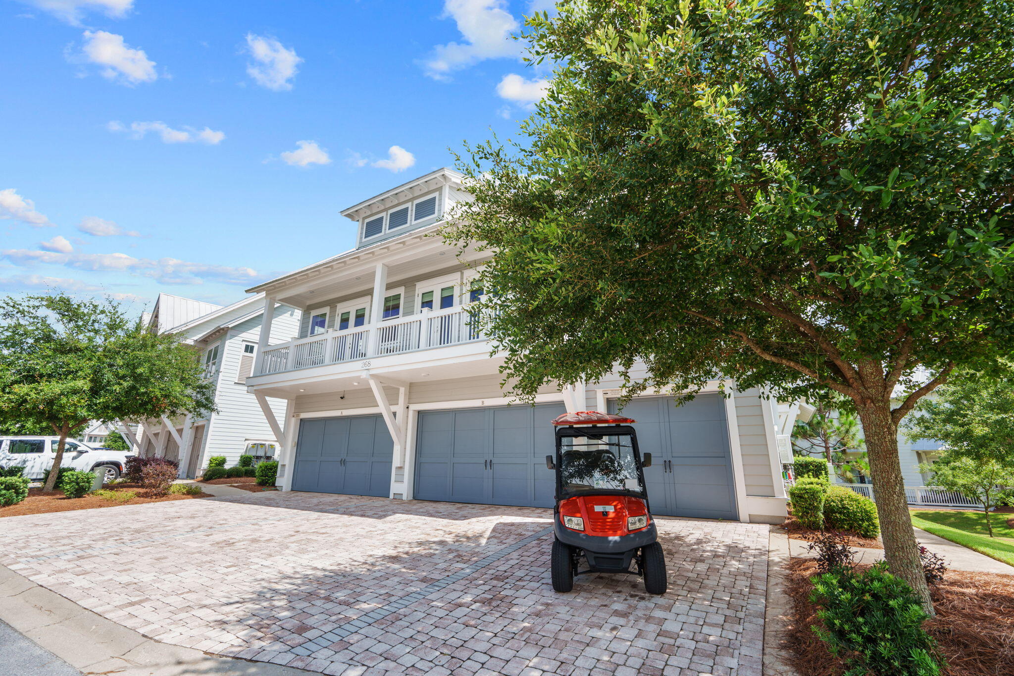 268 Milestone Dr Inlet Beach, Unit C Inlet Beach, FL 32461 - Photo 2 of 34 a car parked in front of house with a small yard