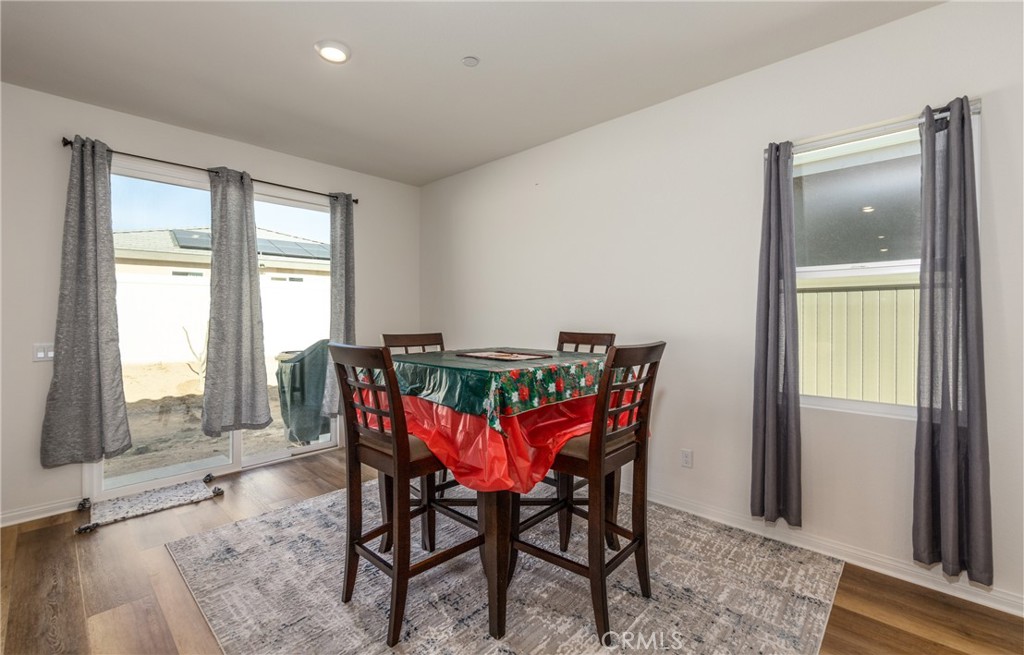 19778 Limon Court Riverside, CA 92507 - Photo 13 of 26 a view of a dining room with furniture and a window