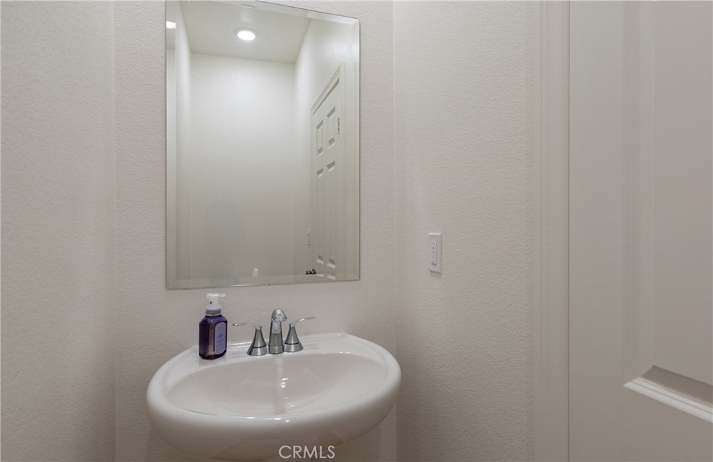 19778 Limon Court Riverside, CA 92507 - Photo 17 of 26 a bathroom with a sink and a mirror