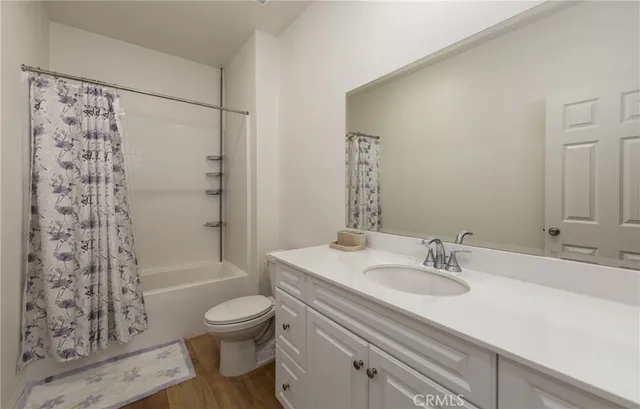 a bathroom with a sink toilet tub and shower