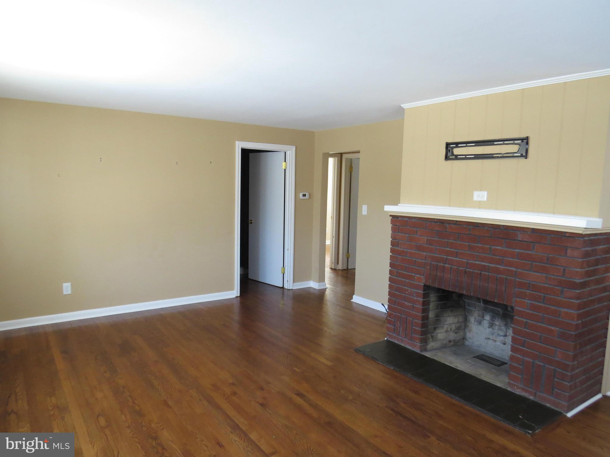 215 Maloney Road Elkton, MD 21921 - Photo 3 of 12 Living Room with fireplace,hardwoods