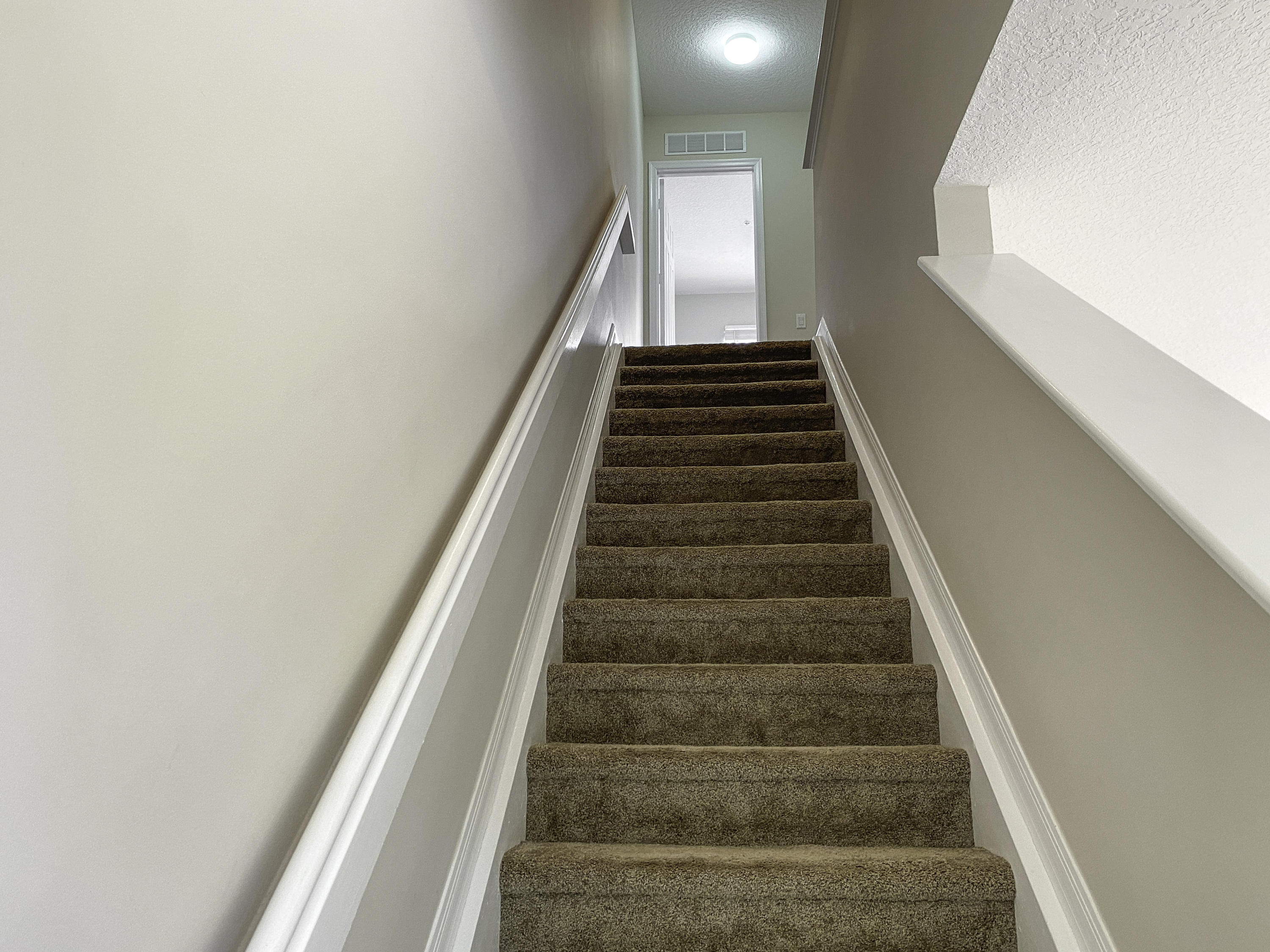 1480 Corbison Point Place Jupiter, FL 33458 - Photo 13 of 28 Staircase from 2nd to 3rd Floor
