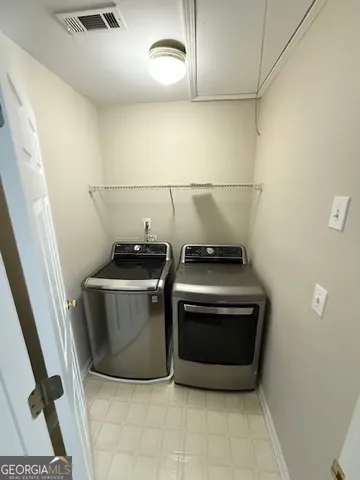 a utility room with washer and dryer