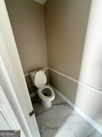 a bathroom with a toilet