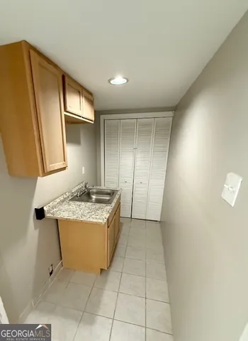 a view of balcony with wooden floor