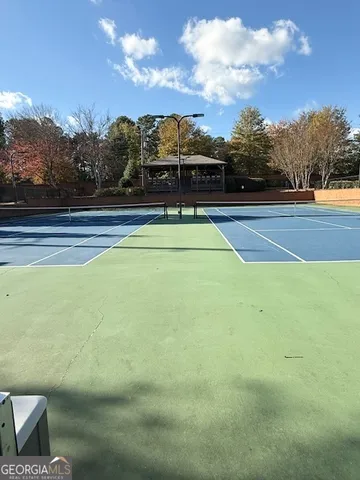 a view of a wrought iron fences in front of house