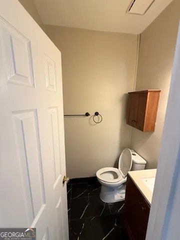 a bathroom with a toilet and a sink