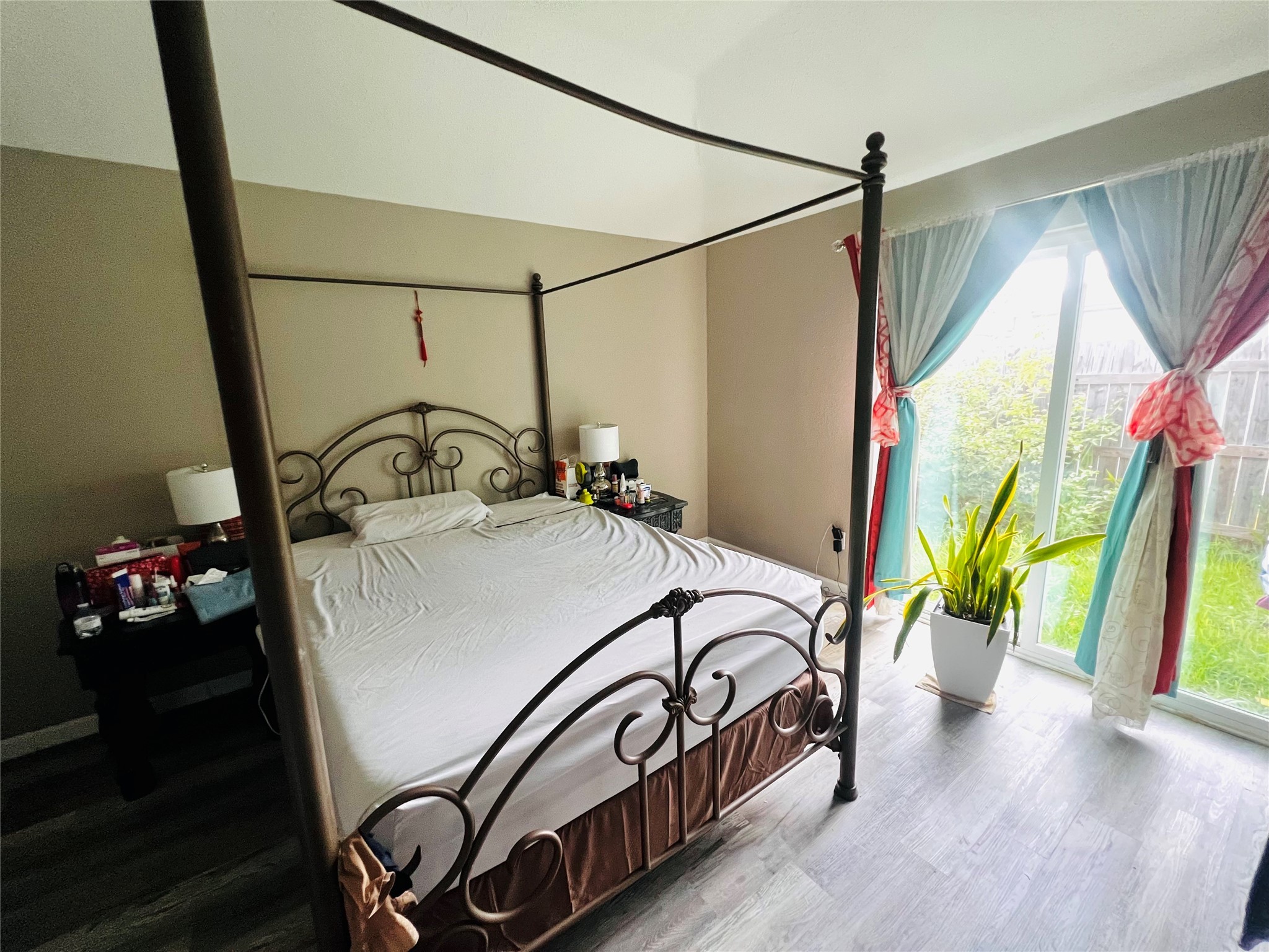 9415 Danforth Way Houston, TX 77083 - Photo 8 of 10 a bedroom with a bed next to a large window with the outer view