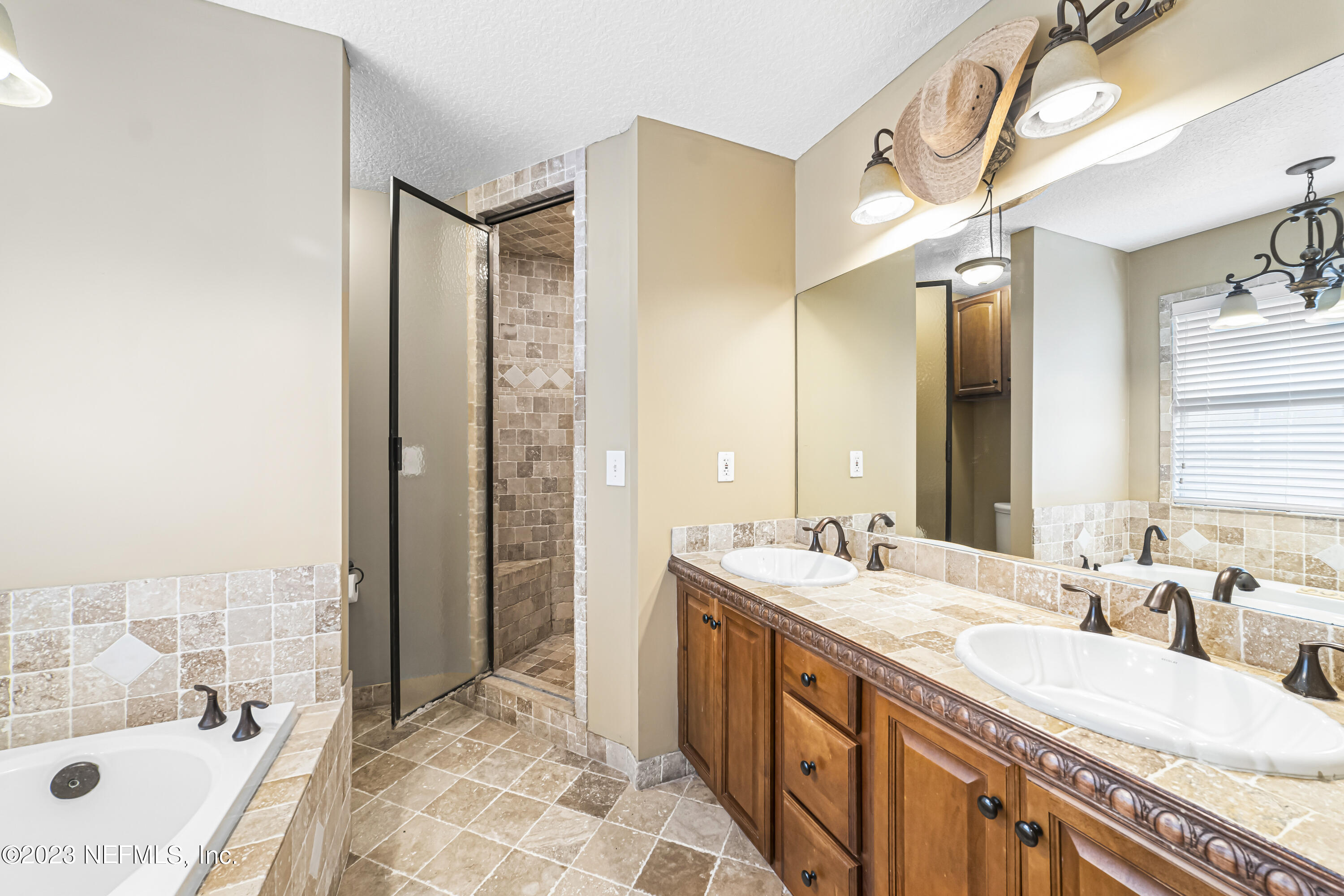 54412 Church Road Callahan, FL 32011 - Photo 15 of 47 a spacious bathroom with a tub sink and mirror